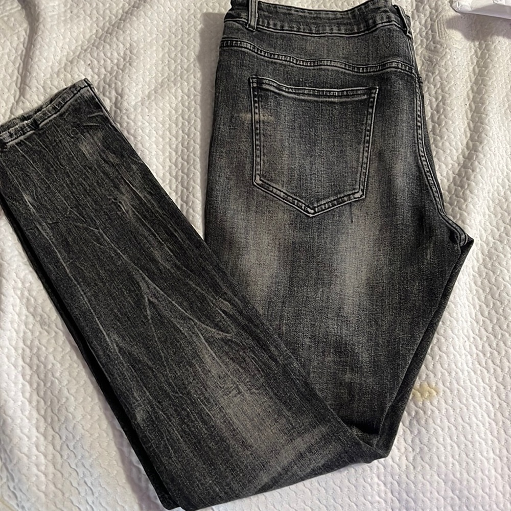Black jeans with black lightning stripe down the side